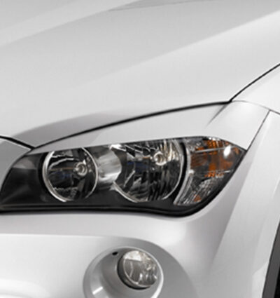 Paupières de phares avants (la paire) pour BMW X1 / E84 hatchback (2009-7/2012) - Fabriqué en ABS (à peindre)