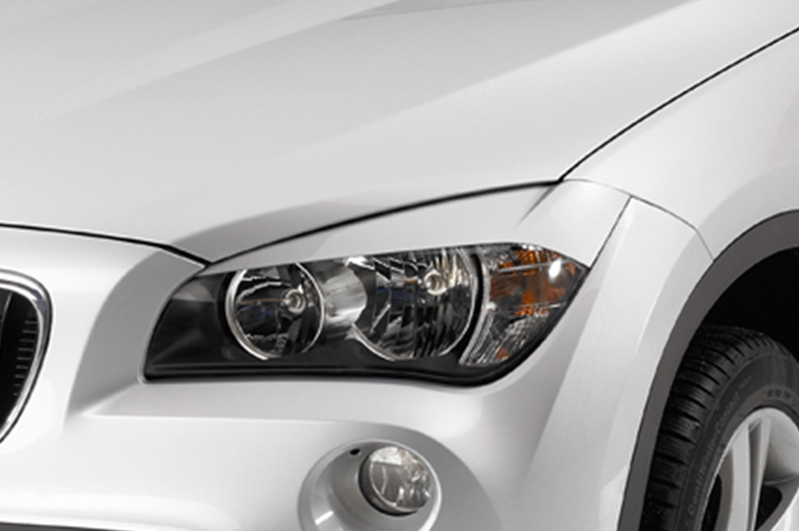 Paupières de phares avants (la paire) pour BMW X1 / E84 hatchback (2009-7/2012) - Fabriqué en ABS (à peindre)