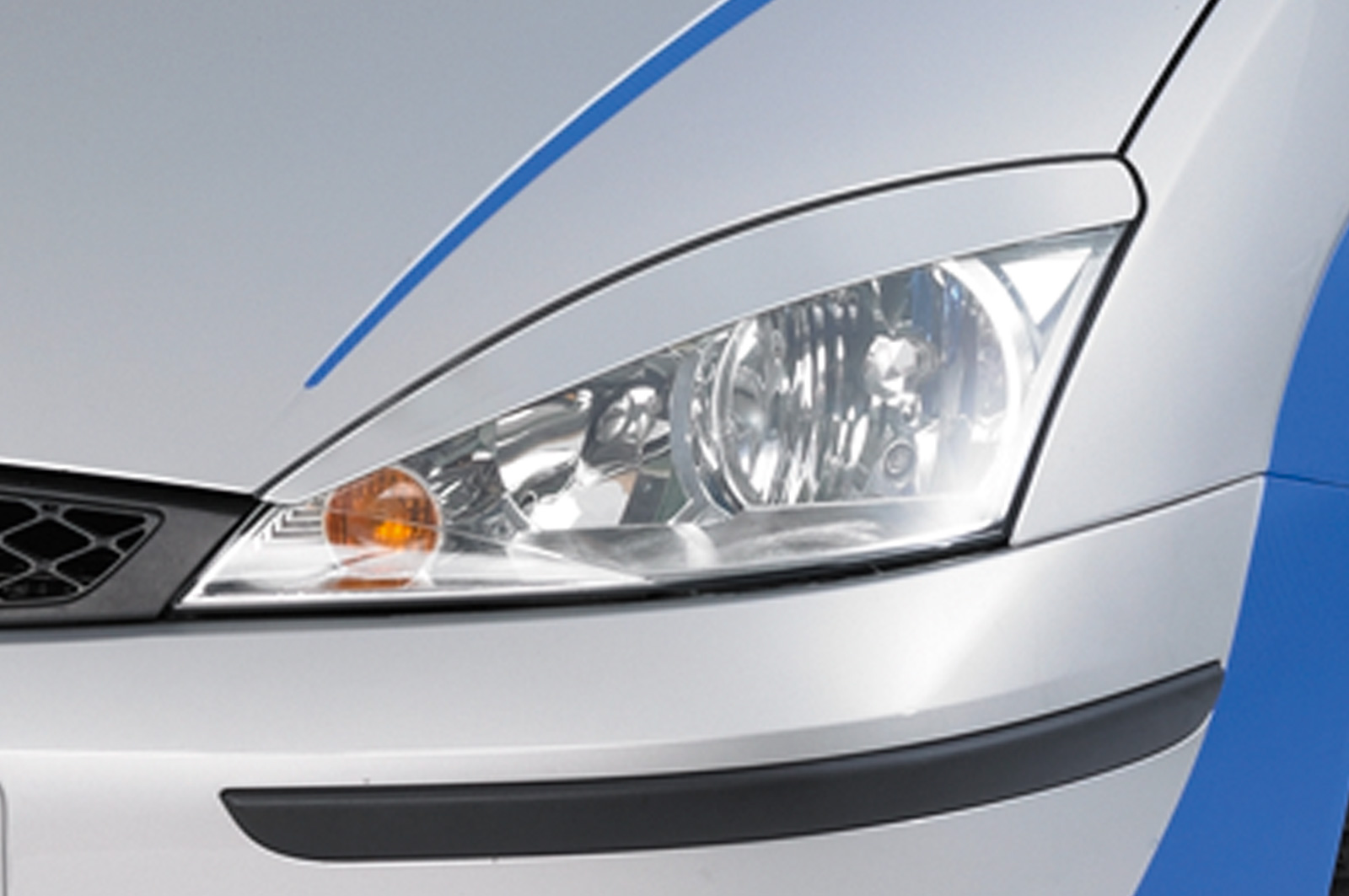 Paupières de phares avants (la paire) pour Ford Focus MK1 (DAW / DFW / DNW) berline / liftback / break (1998-2004) - Fabriqué en ABS (à peindre)