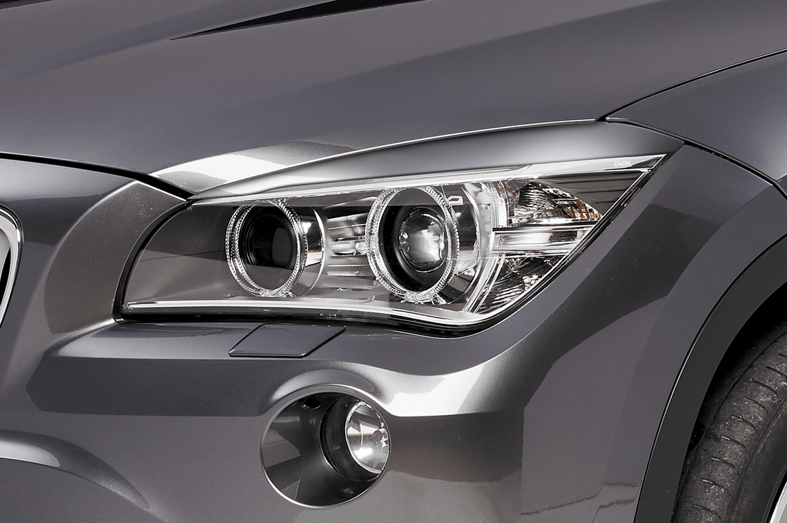 Paupières de phares avants (la paire) pour BMW X1 E84 LCI toutes carrosseries (7/2012-5/2015) - Fabriqué en ABS (à peindre)